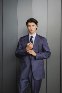 A male model and influencer poses for the camera.