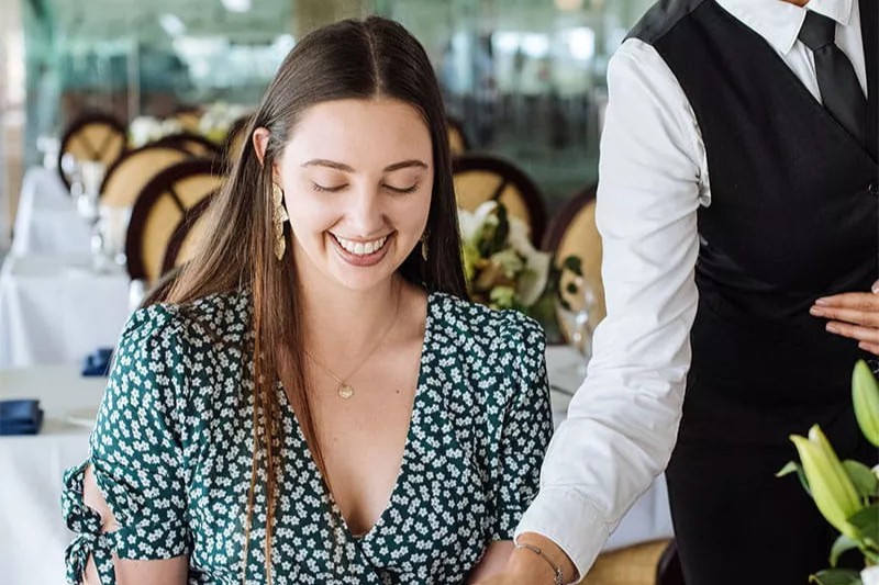 A woman dines in a restaurant at Canterbury Park racecourse.